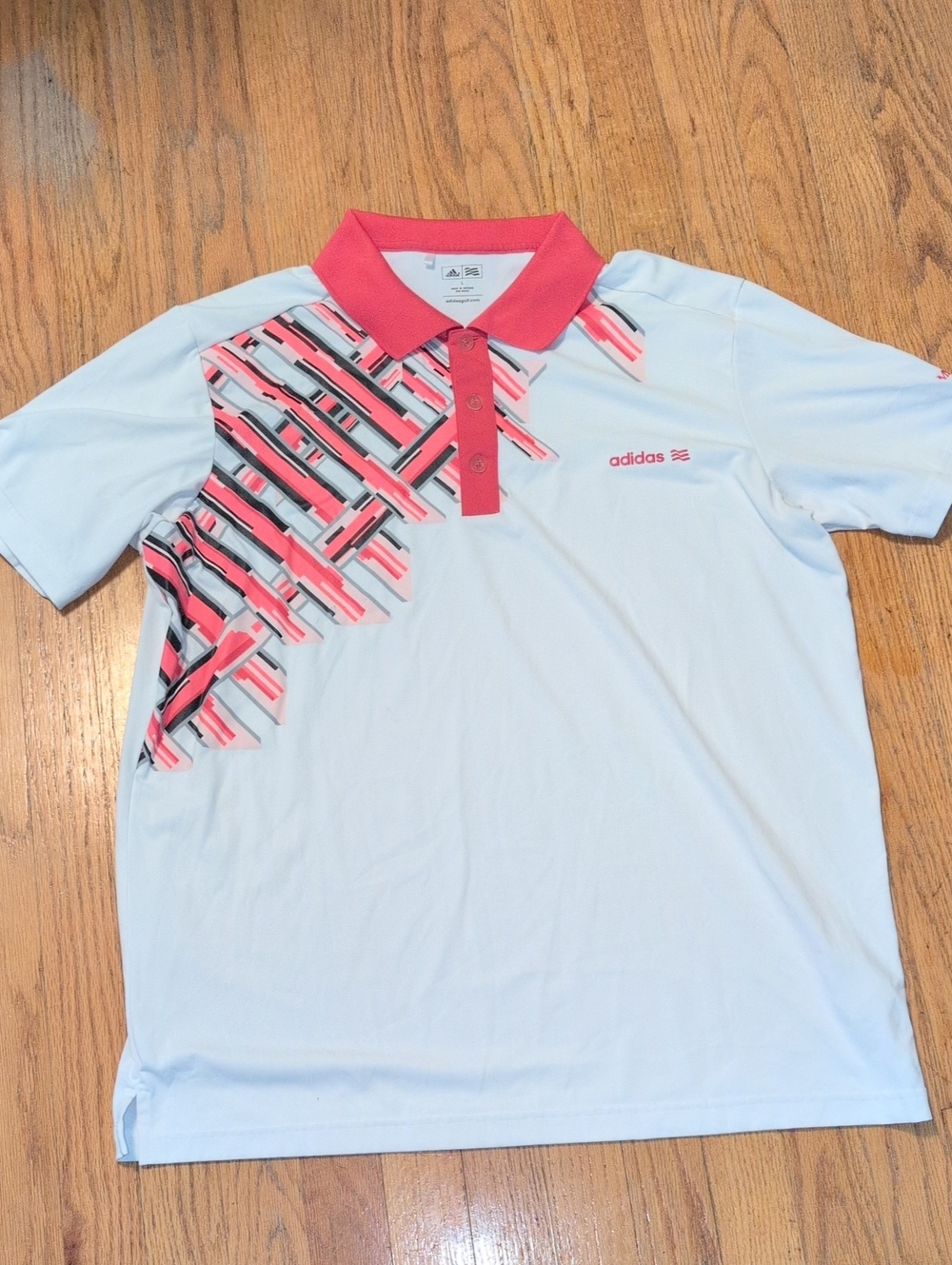 adidas Men’s White Polo with Coral Accent and Geometric Print